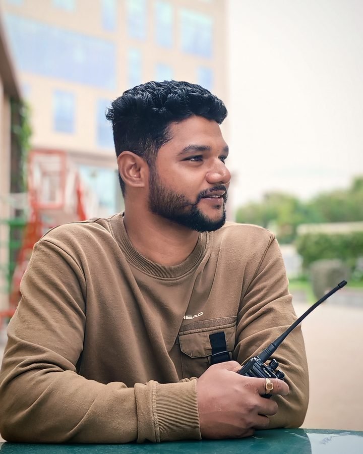 Sammed Sambhoje on set, holding a walkie-talkie